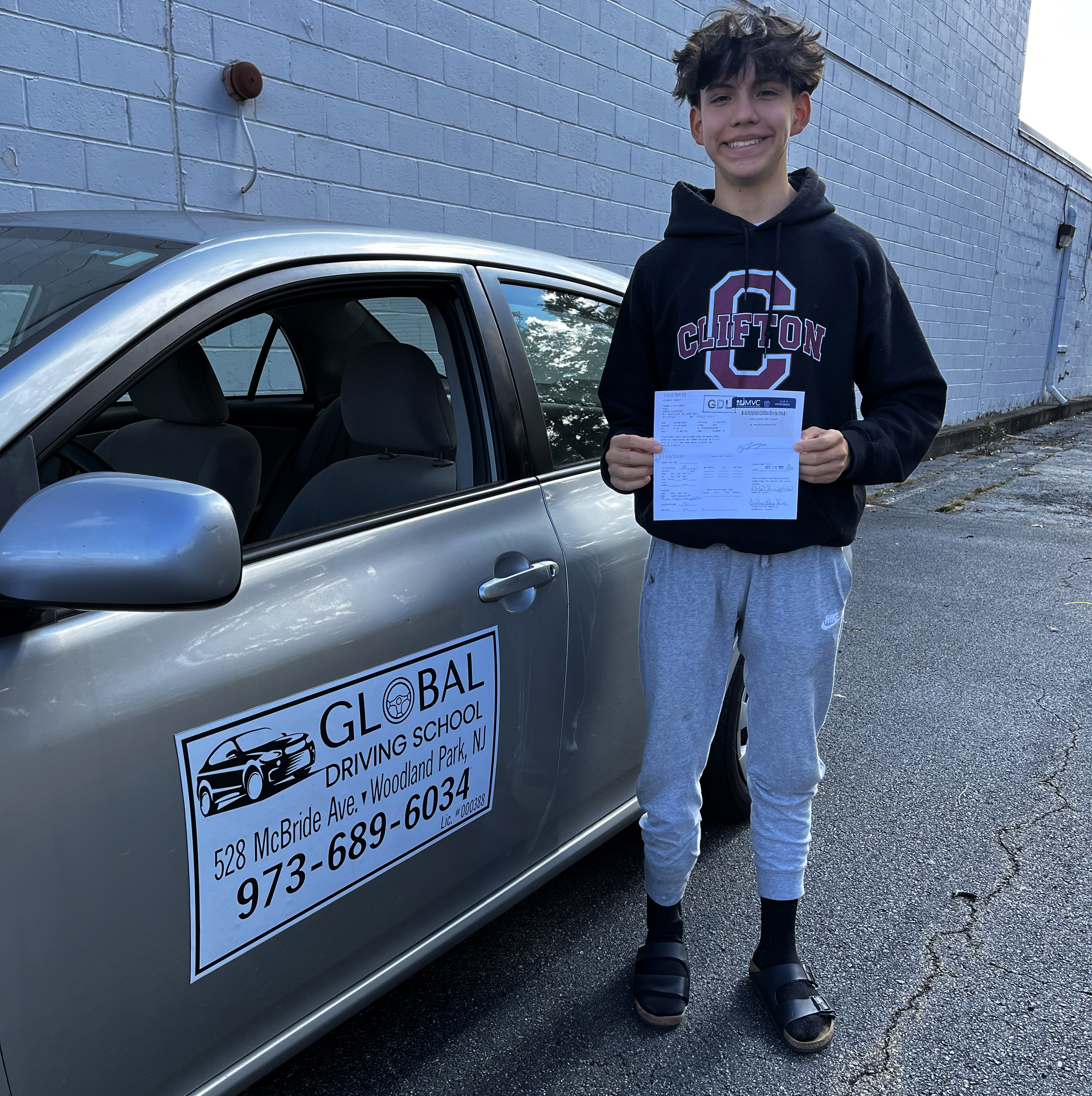 Image of young student in driving school car.