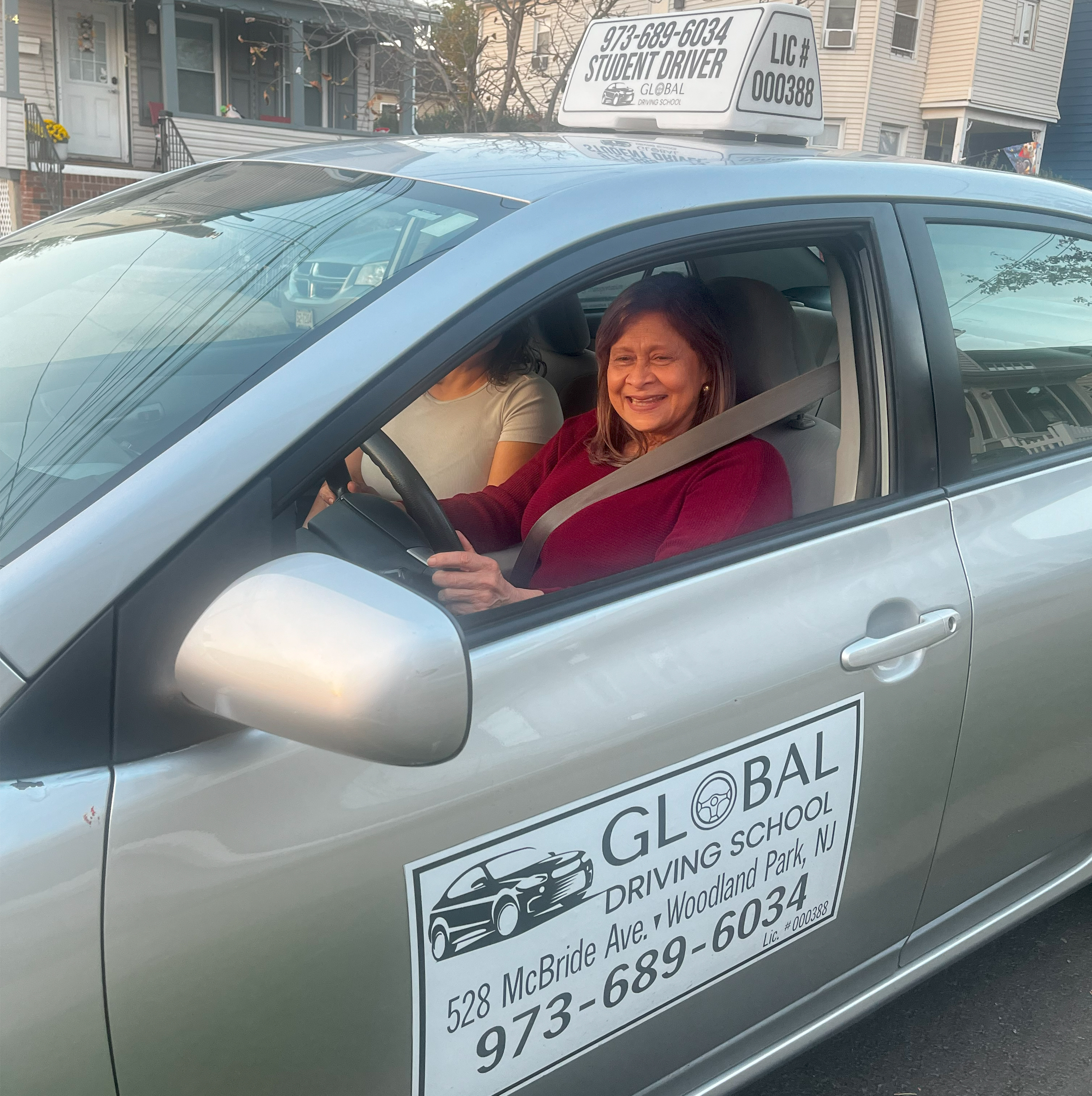 Image of elderly student in driving school car